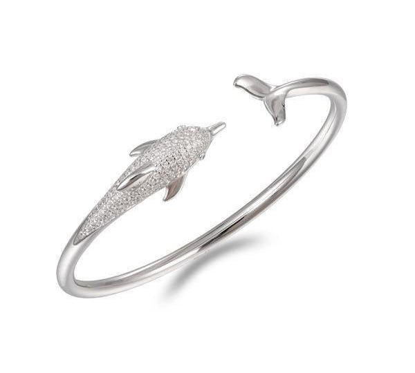 The picture shows a 925 sterling silver dolphin bangle with topaz.