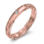 The picture shows a 14K rose gold diamond 3mm ring with hand engravings and a diamond.