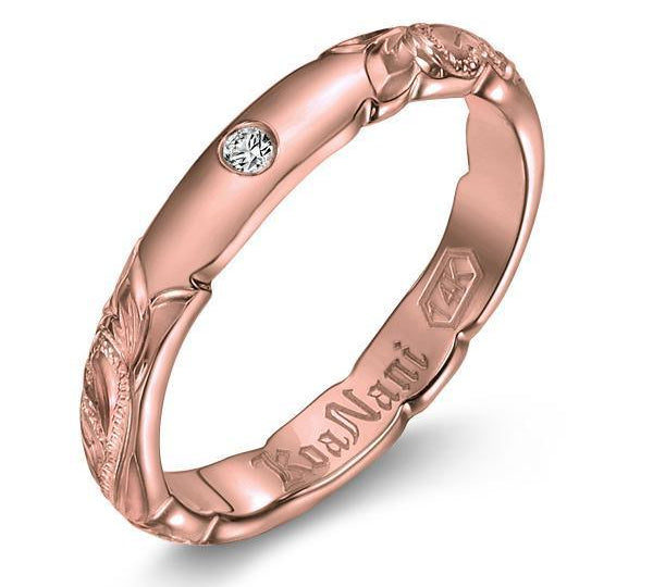 The picture shows a 14K rose gold diamond 3mm ring with hand engravings and a diamond.