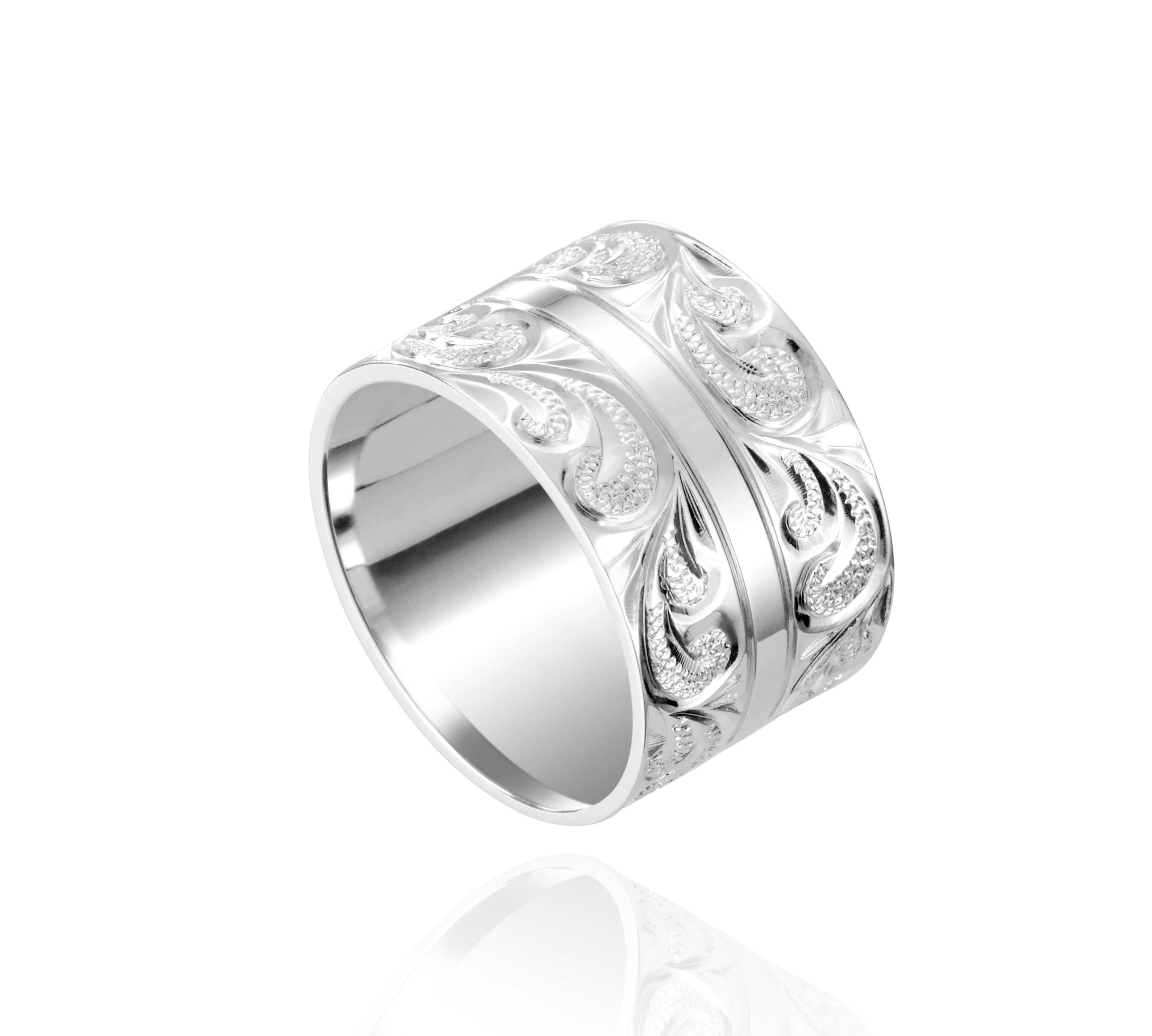 The picture shows a 925 sterling silver 12 mm ring with hand engravings of scrolls.