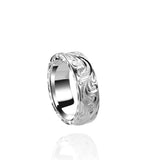 The picture shows a 925 sterling silver wave ring with scroll hand engravings.