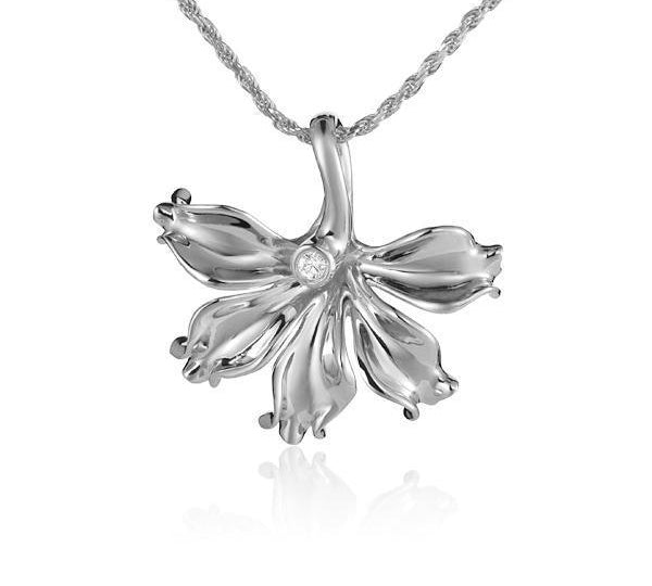 In this photo there is a white gold naupaka flower pendant with one diamond.