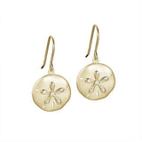 The picture shows a pair of yellow gold sand dollar hook earrings with topaz.