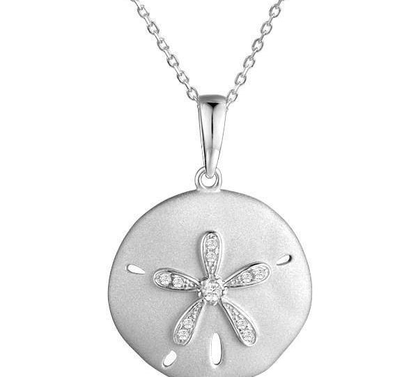 The picture shows a white gold sand dollar pendant with topaz.