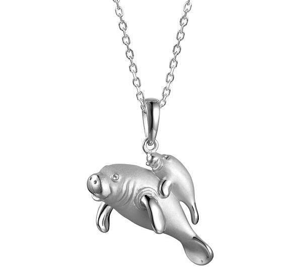 The picture shows a 925 sterling silver family of manatees pendant.