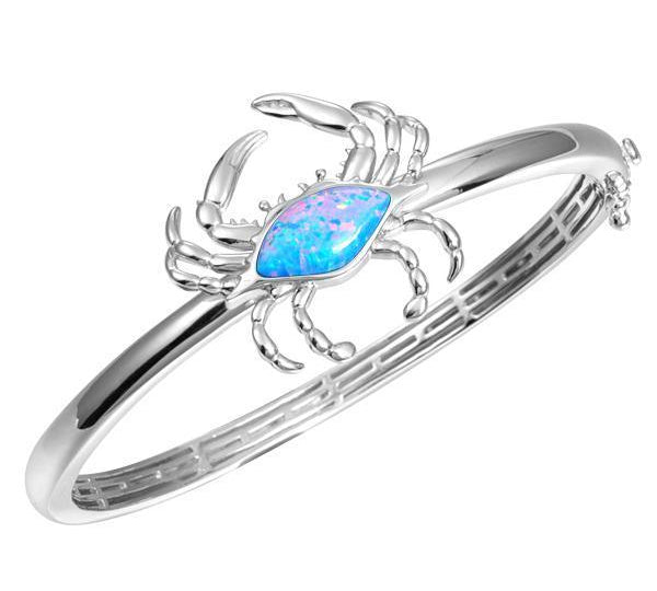 The picture shows a 925 sterling silver blue crab bangle with opalite.