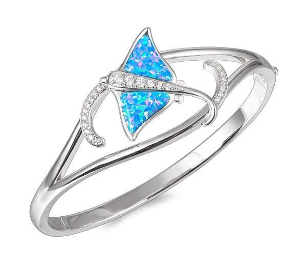 The picture shows a 925 sterling silver eagle ray bangle with two opalite gemstones and topaz.