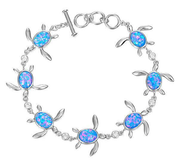 The picture shows a 925 sterling silver opalite sea turtle charm bracelet with cubic zirconia.