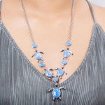 The picture shows a 925 sterling silver opalite sea turtle charm necklace.