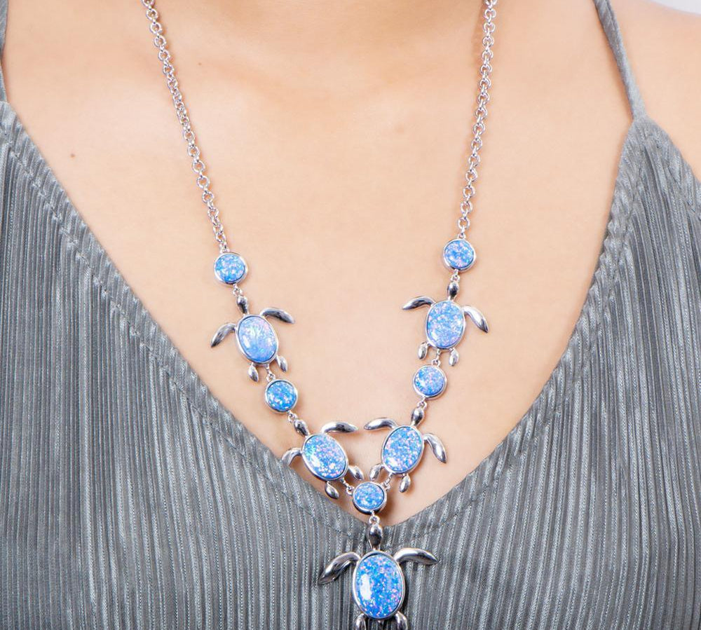 The picture shows a 925 sterling silver opalite sea turtle charm necklace.
