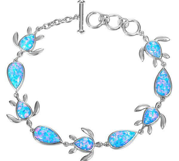 The picture shows a 925 sterling silver opalite sea turtle and teardrop charm bracelet.