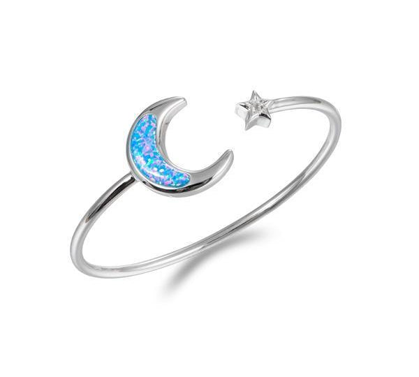 The picture shows a 925 sterling silver moon and star bangle with opalite and topaz.