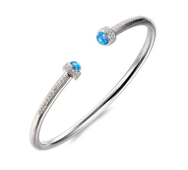 The picture shows a 925 sterling silver bangle with two opalite gemstones and topaz.