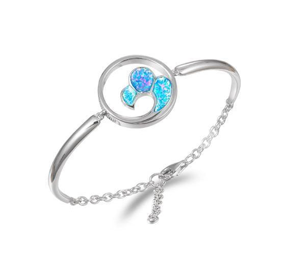 In this photo there is a 925 sterling silver big wave bracelet with blue opalite gemstones.