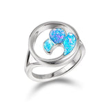 The picture shows a 925 sterling silver opalite wave ring with a split band.