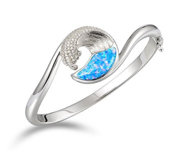 The picture shows a 925 sterling silver wave bangle with opalite and cubic zirconia.