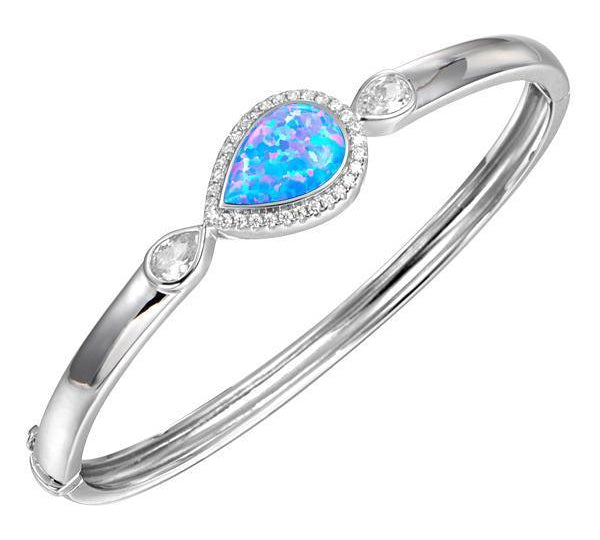 The picture shows a 925 sterling silver teardrop opalite bangle with topaz.