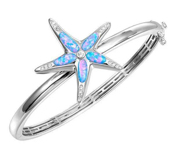 The picture shows a 925 sterling silver opalite sea star bangle bangle with topaz.