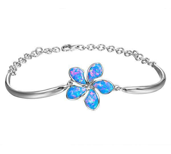 In this photo there is a 925 sterling silver plumeria bracelet with blue opalite gemstones.