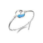 The picture shows a 925 sterling silver opalite whale tail wave bracelet.