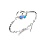 The picture shows a 925 sterling silver opalite whale tail wave bracelet.
