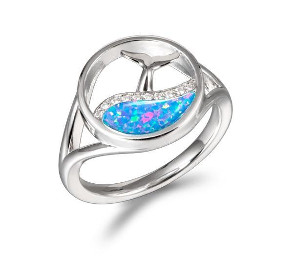 The picture shows a 925 sterling silver opalite whale tail in a wave ring with topaz.