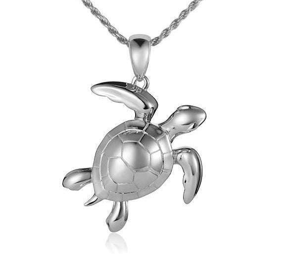 The picture shows a 14K white gold sea turtle pendant.