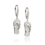 In this photo there is a pair of sterling silver beach slipper earrings with topaz gemstones.