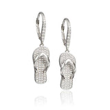 In this photo there is a pair of sterling silver beach slipper earrings with topaz gemstones.