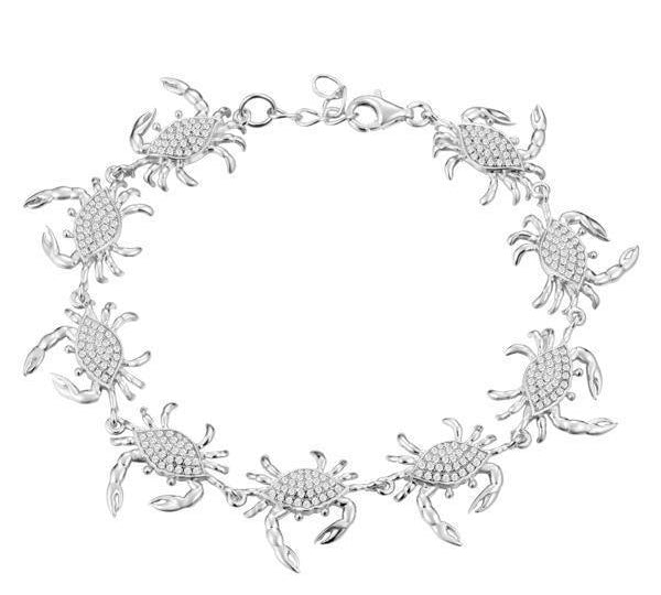The picture shows a 925 sterling silver white gold plated blue crab bracelet with topaz.