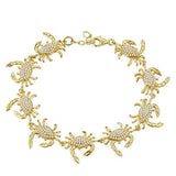 The picture shows a 925 sterling silver yellow gold plated blue crab bracelet with topaz.