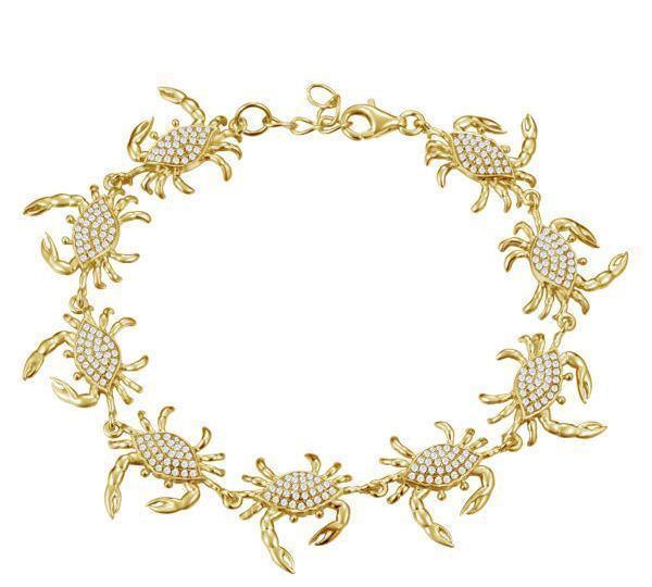 The picture shows a 925 sterling silver yellow gold plated blue crab bracelet with topaz.