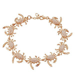The picture shows a 925 sterling silver rose gold plated blue crab bracelet with topaz.