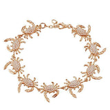 The picture shows a 925 sterling silver rose gold plated blue crab bracelet with topaz.