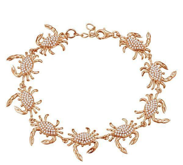 The picture shows a 925 sterling silver rose gold plated blue crab bracelet with topaz.