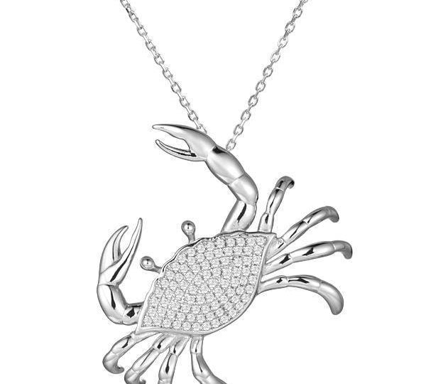 The picture shows a 14K white gold pavé diamond blue crab pendant.