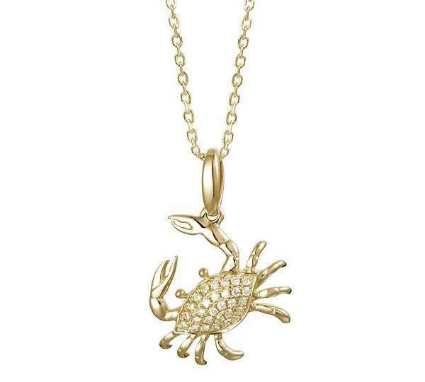 The picture shows a small 14K yellow gold pavé diamond blue crab pendant.