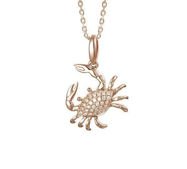 The picture shows a small 14K rose gold pavé diamond blue crab pendant.