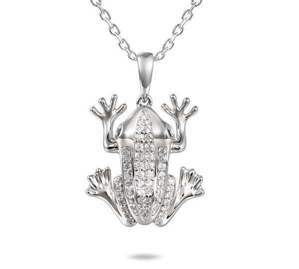 In this photo there is a sterling silver coqui frog pendant with aquamarine gemstones.