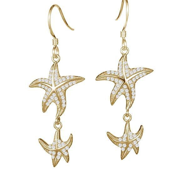 The picture shows a pair of 14K yellow gold pavé diamond starfish hook earrings.