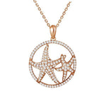 The picture shows a 925 sterling silver, rose gold vermeil, double starfish circle pendant with topaz.