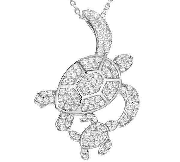 The picture shows a 925 sterling silver, white gold vermeil, double sea turtle pendant with topaz.