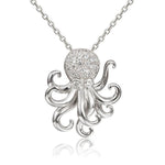 The picture shows a 925 sterling silver pavé octopus pendant with topaz.