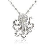 The picture shows a 925 sterling silver pavé octopus pendant with topaz.