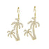 The picture shows a pair of 14K yellow gold pavé palm trees hook earrings with diamonds.