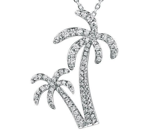 In this photo there is a white gold double palm tree pendant with topaz gemstones.