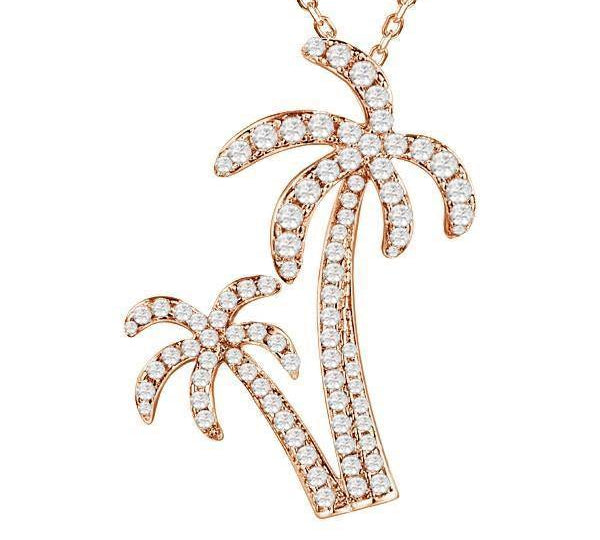 In this photo there is a rose gold double palm tree pendant with topaz gemstones.