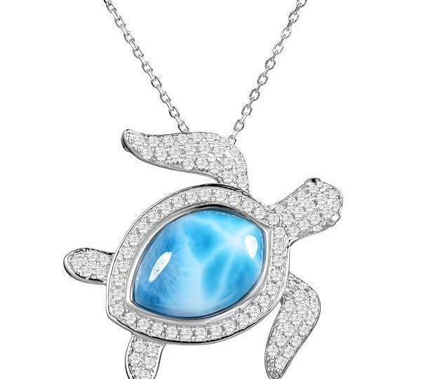The picture shows a 925 sterling silver pavé larimar sea turtle pendant with cubic zirconia.