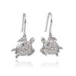 The picture shows a pair of 925 sterling silver sea turtle hook earrings with topaz.