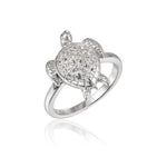 The picture shows a 925 sterling silver sea turtle ring with topaz gemstones on its shell